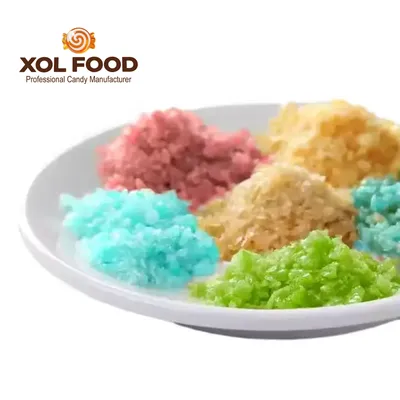 Multicolored popping candy granules shown in piles on a plate